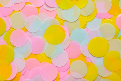 Photo of Bright colorful confetti as background, top view