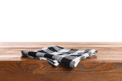 Photo of Checkered tablecloth on wooden table against white background