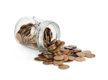 Photo of Overturned glass jar with coins isolated on white