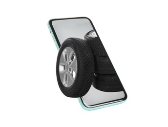 Image of Online auto store, delivery service. Modern smartphone and car tires on white background