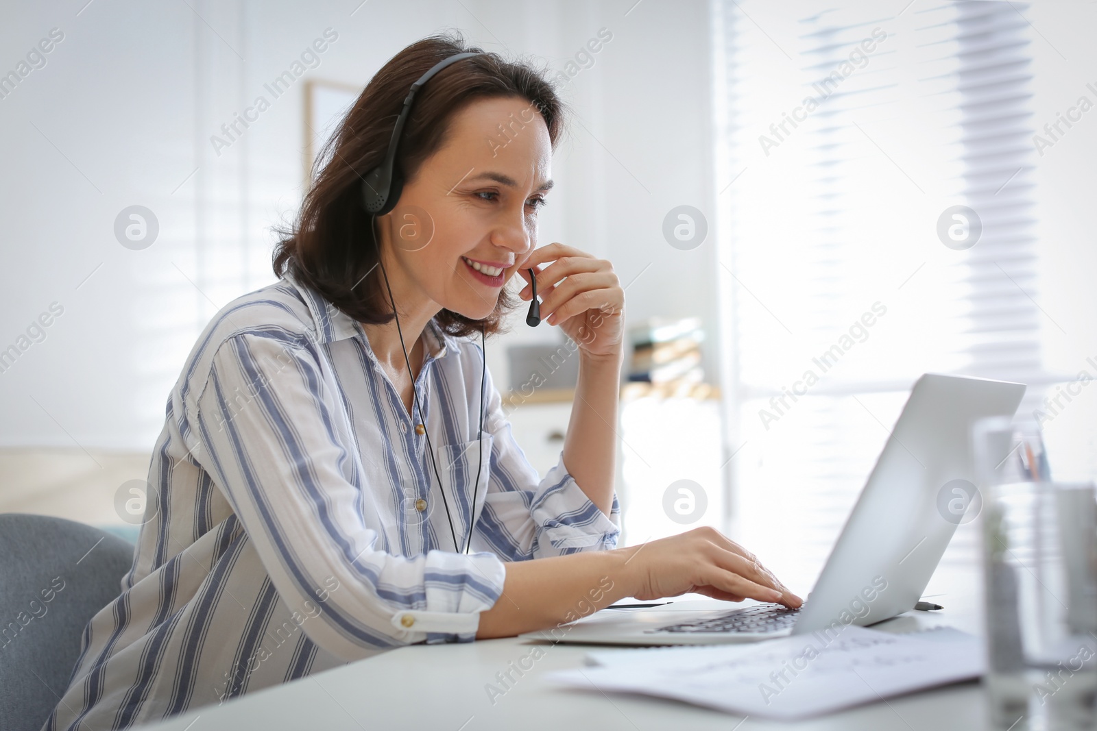 Photo of Teacher conducting online lesson at home during COVID-19 quarantine