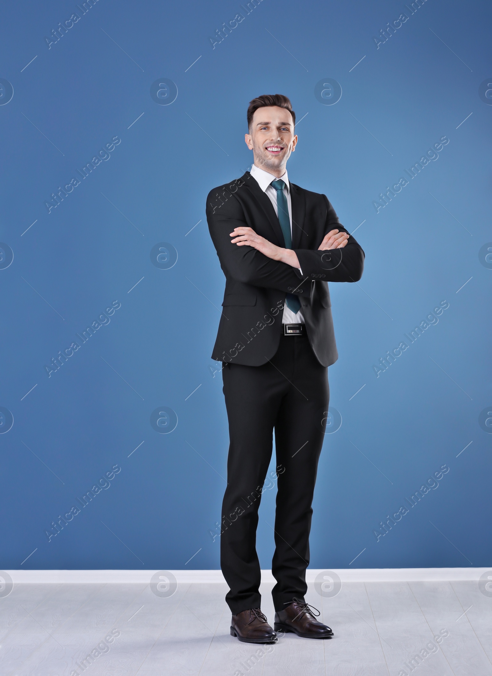 Photo of Young business trainer against color wall