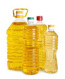 Photo of Bottles of cooking oil on white background