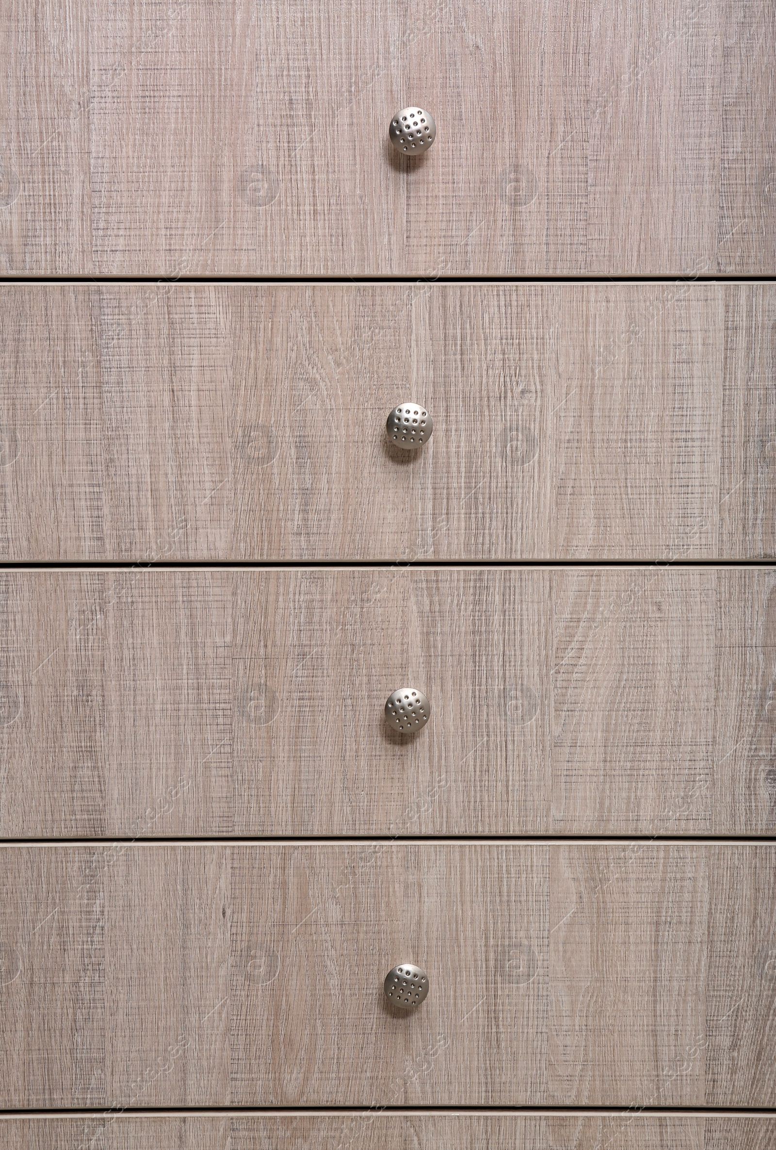 Photo of Wooden wardrobe drawers as background, closeup view