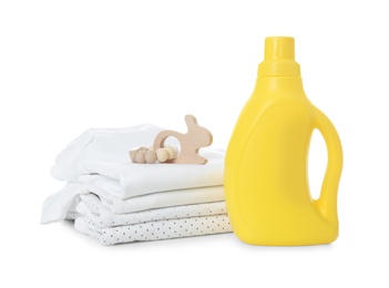 Photo of Detergent and children's clothes on white background