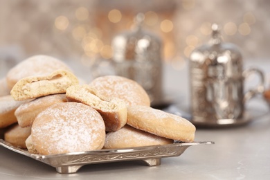 Traditional cookies for Islamic holidays on table, closeup. Eid Mubarak