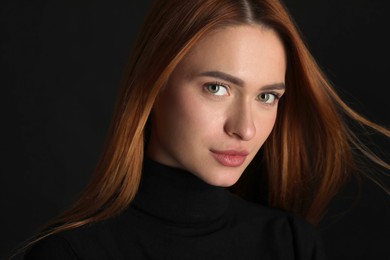 Photo of Evil eye. Young woman with scary eyes on black background