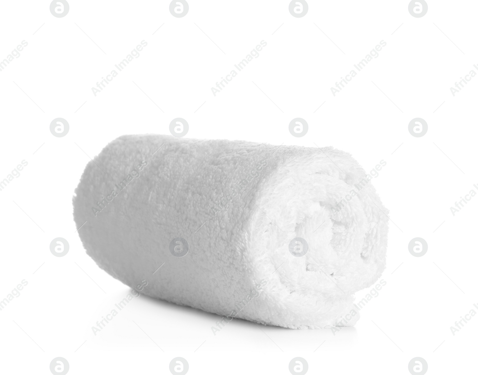 Photo of Rolled clean soft towel on white background