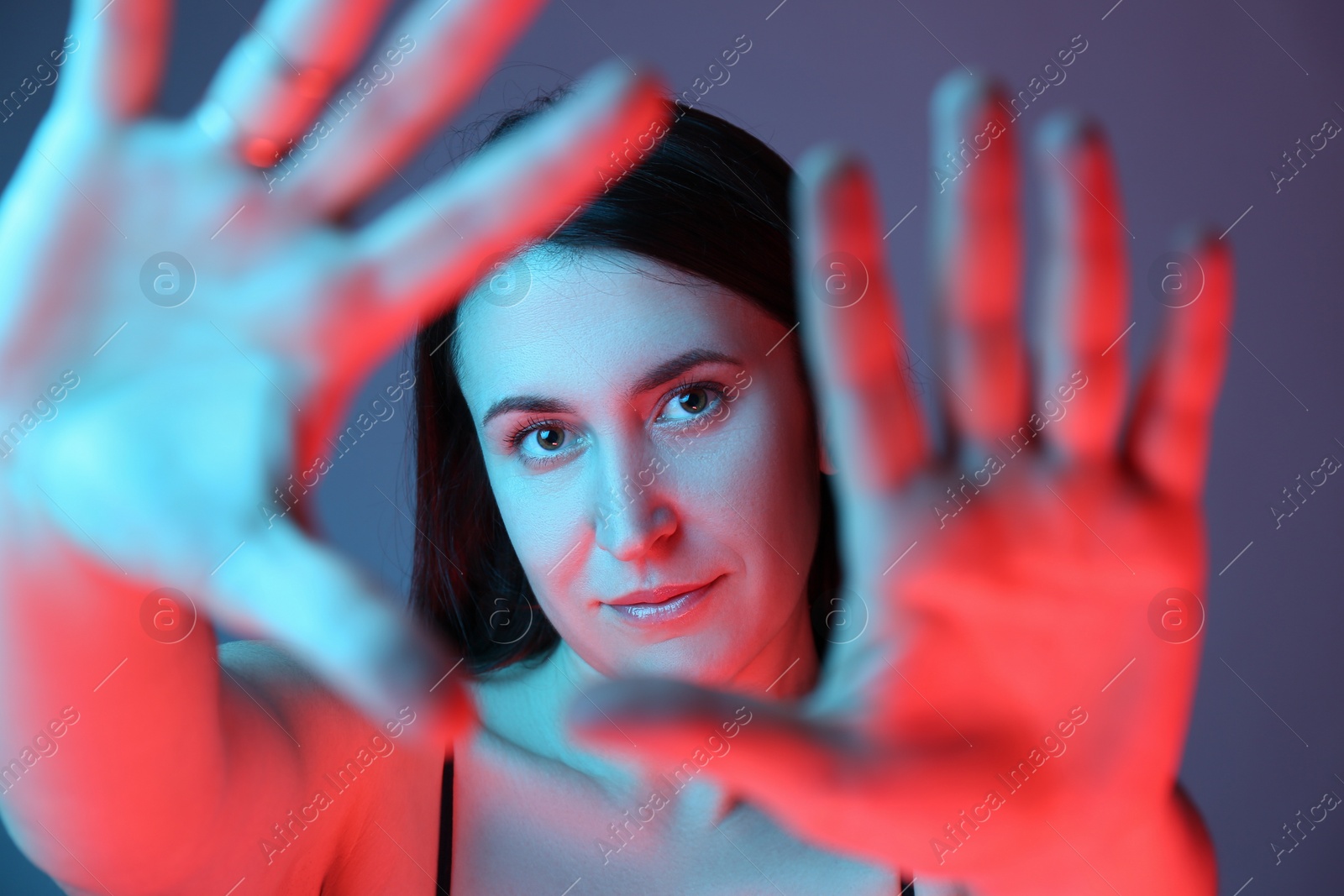 Photo of Beautiful young woman on color background, closeup