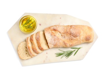 Photo of Cut delicious French baguette with rosemary and oil isolated on white, top view