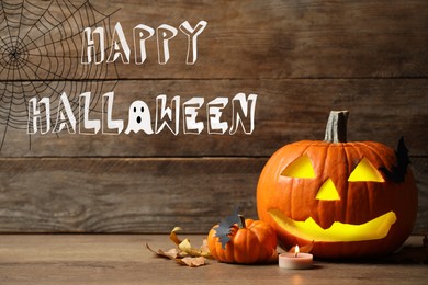 Image of Happy Halloween. Composition with carved pumpkin and decor on wooden table