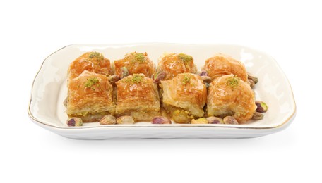 Plate of delicious baklava with pistachio nuts on white background