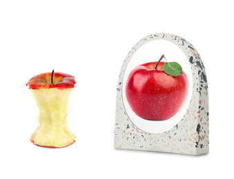 Apple core and mirror with reflection on white background