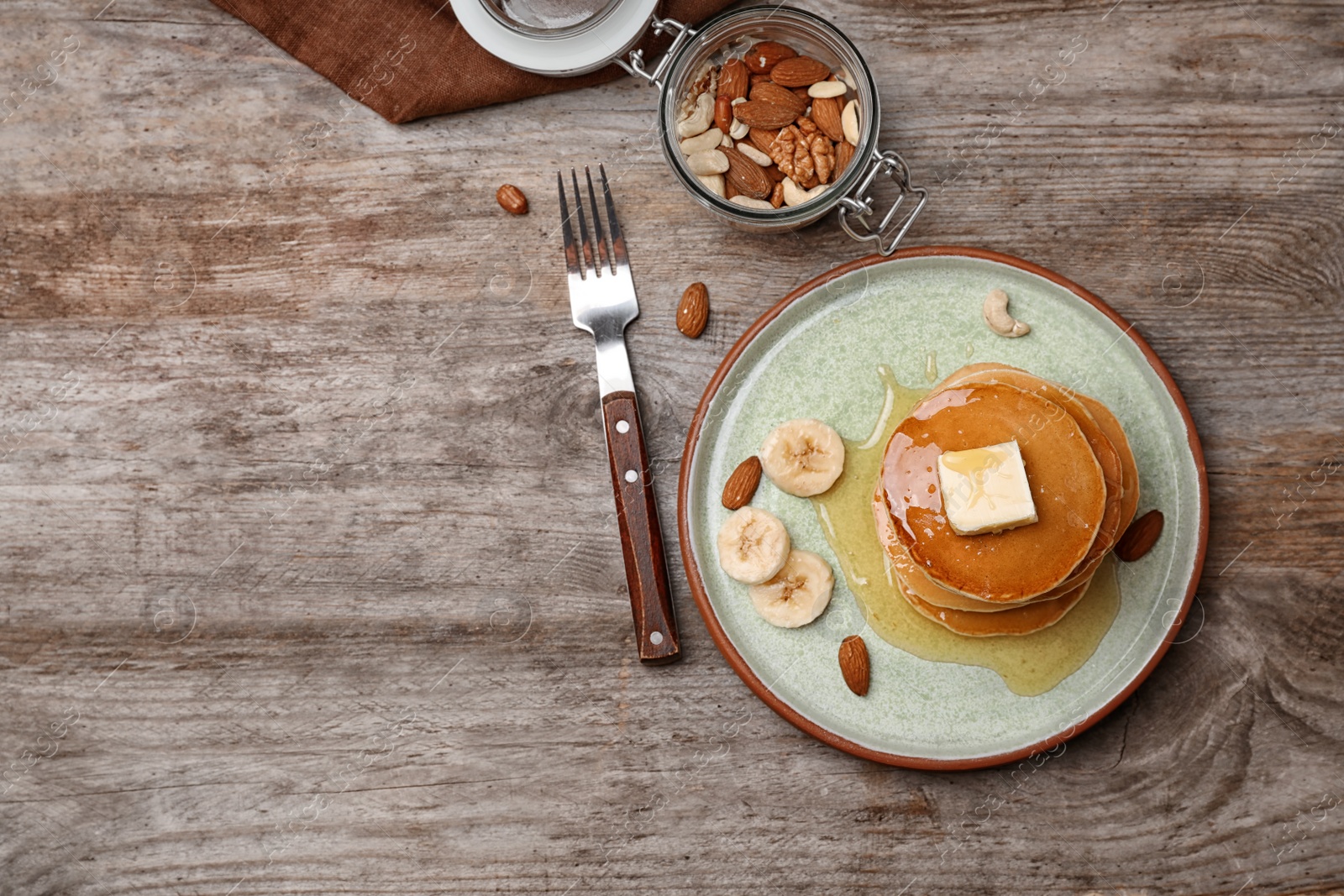 Photo of Flat lay composition with tasty pancakes on wooden background