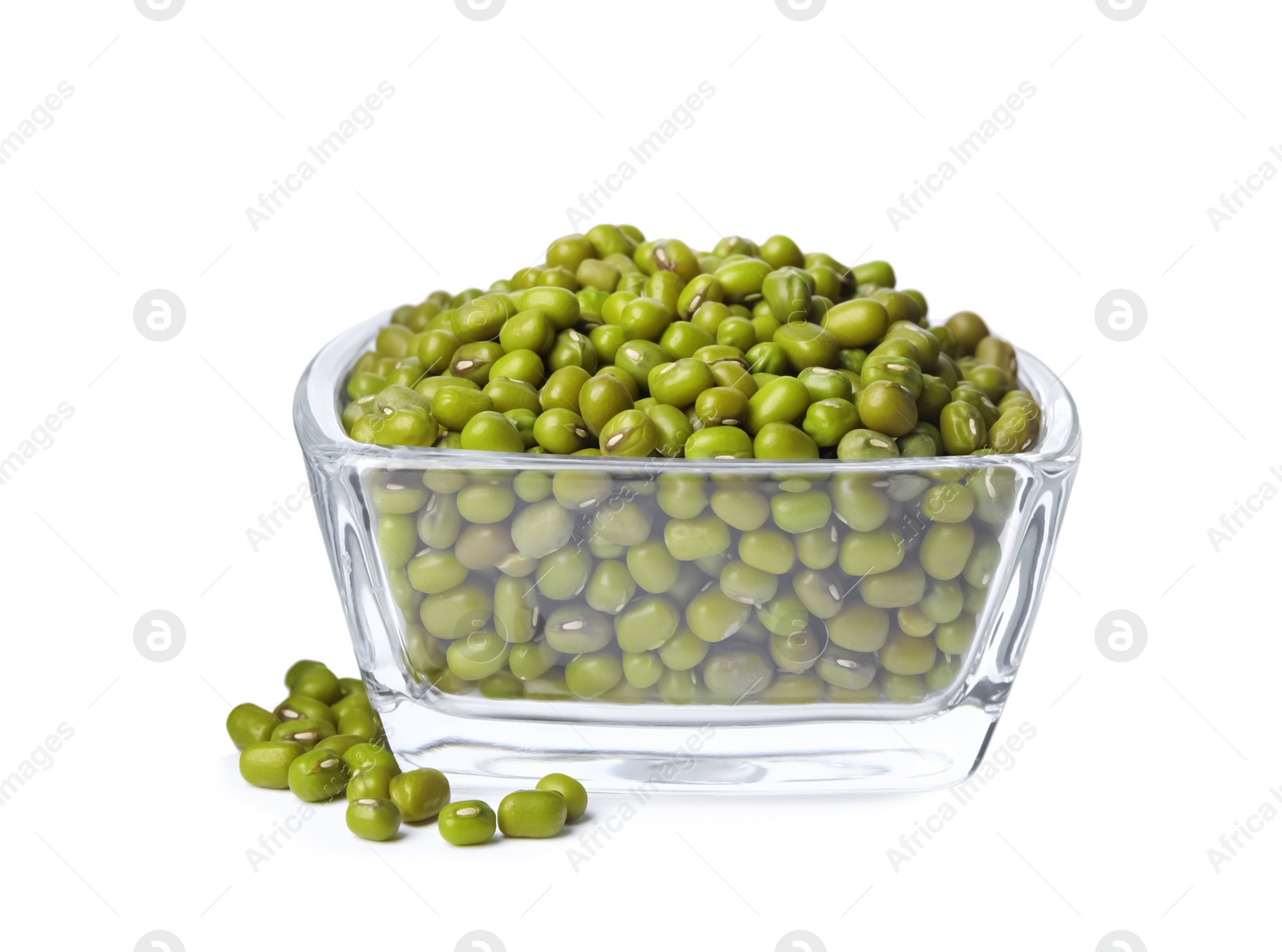 Photo of Glass bowl with green mung beans isolated on white. Organic grains