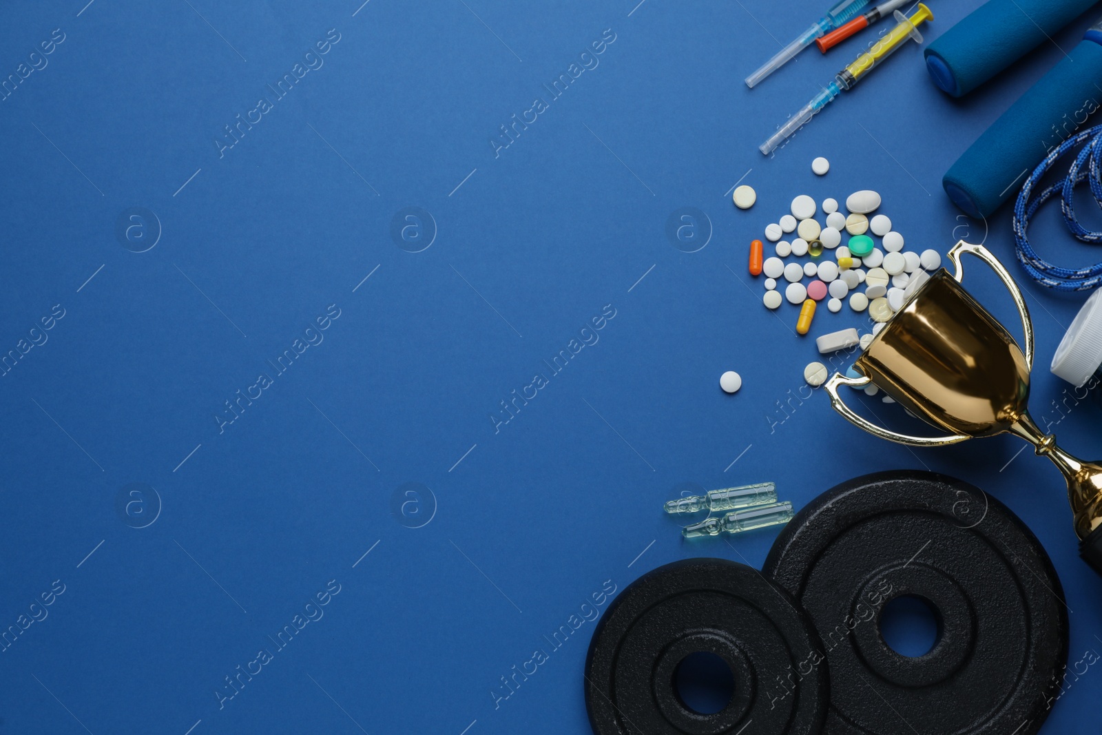 Photo of Flat lay composition with drugs on blue background, space for text. Doping control