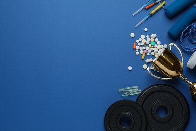 Photo of Flat lay composition with drugs on blue background, space for text. Doping control