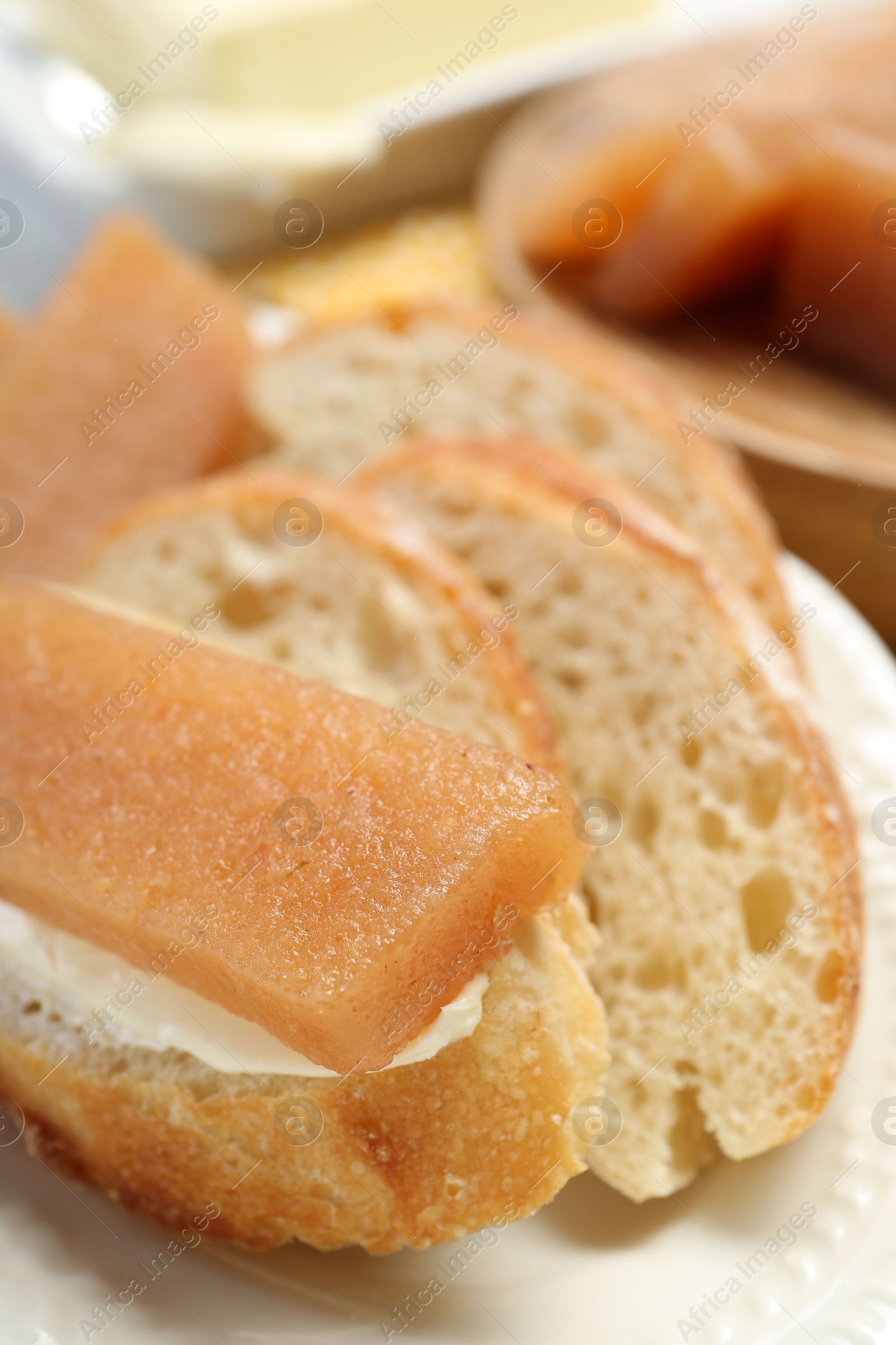 Photo of Delicious quince paste and bread on table, closeup