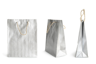 Image of Set of paper shopping bags on white background