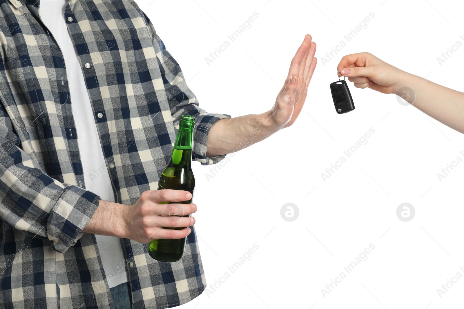 Photo of Man with bottle of beer refusing drive car while woman suggesting him keys on white background, closeup. Don't drink and drive concept