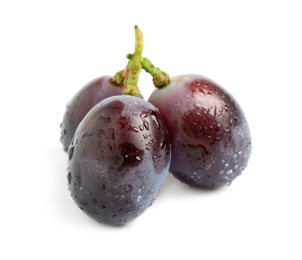 Delicious purple grapes with water drops isolated on white