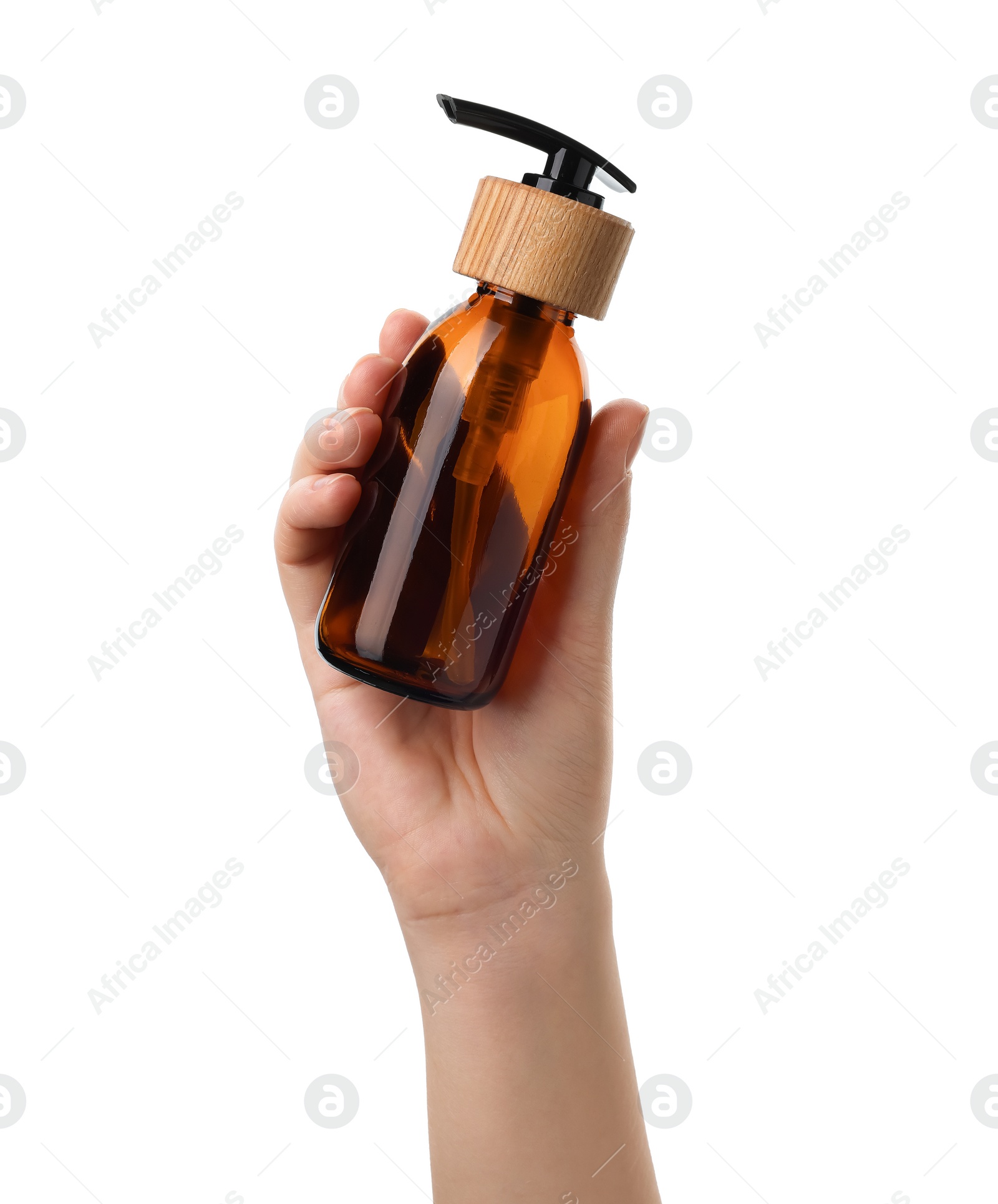 Photo of Woman holding new empty glass bottle with pump dispenser isolated on white, closeup