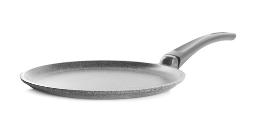 Photo of New crepe frying pan isolated on white. Cooking utensil