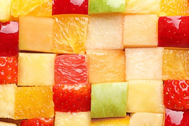 Photo of Fresh cut fruits as background