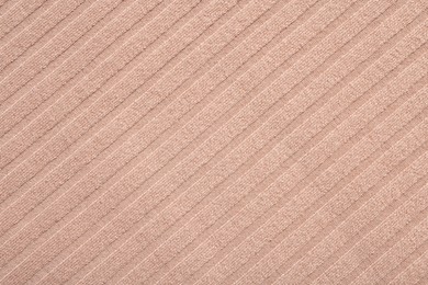 Texture of beige fabric as background, top view