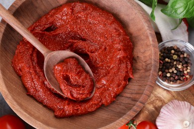 Photo of Tasty tomato paste and ingredients on table, flat lay