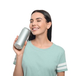 Photo of Beautiful happy woman drinking from beverage can on white background