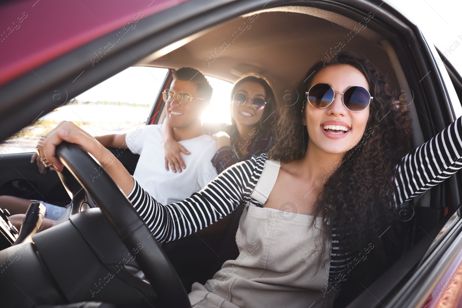 Photo of Happy friends together in car on road trip