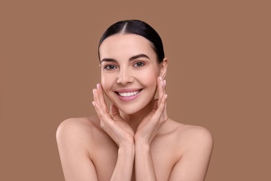 Photo of Beautiful woman with healthy skin on light brown background. Body Care