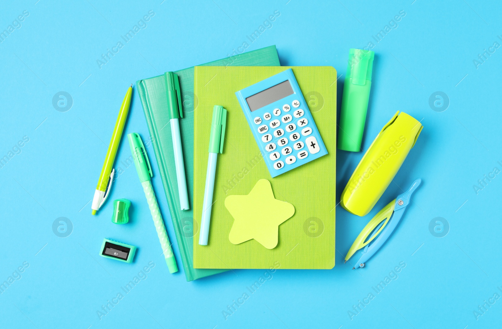 Photo of Different stationery on light blue background, flat lay. Back to school