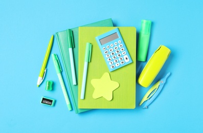 Photo of Different stationery on light blue background, flat lay. Back to school