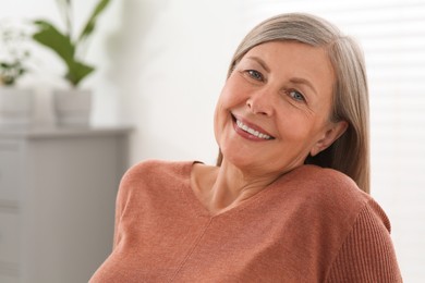 Photo of Portrait of beautiful senior woman at home