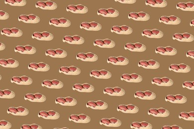 Pattern of unpeeled peanuts on brown background