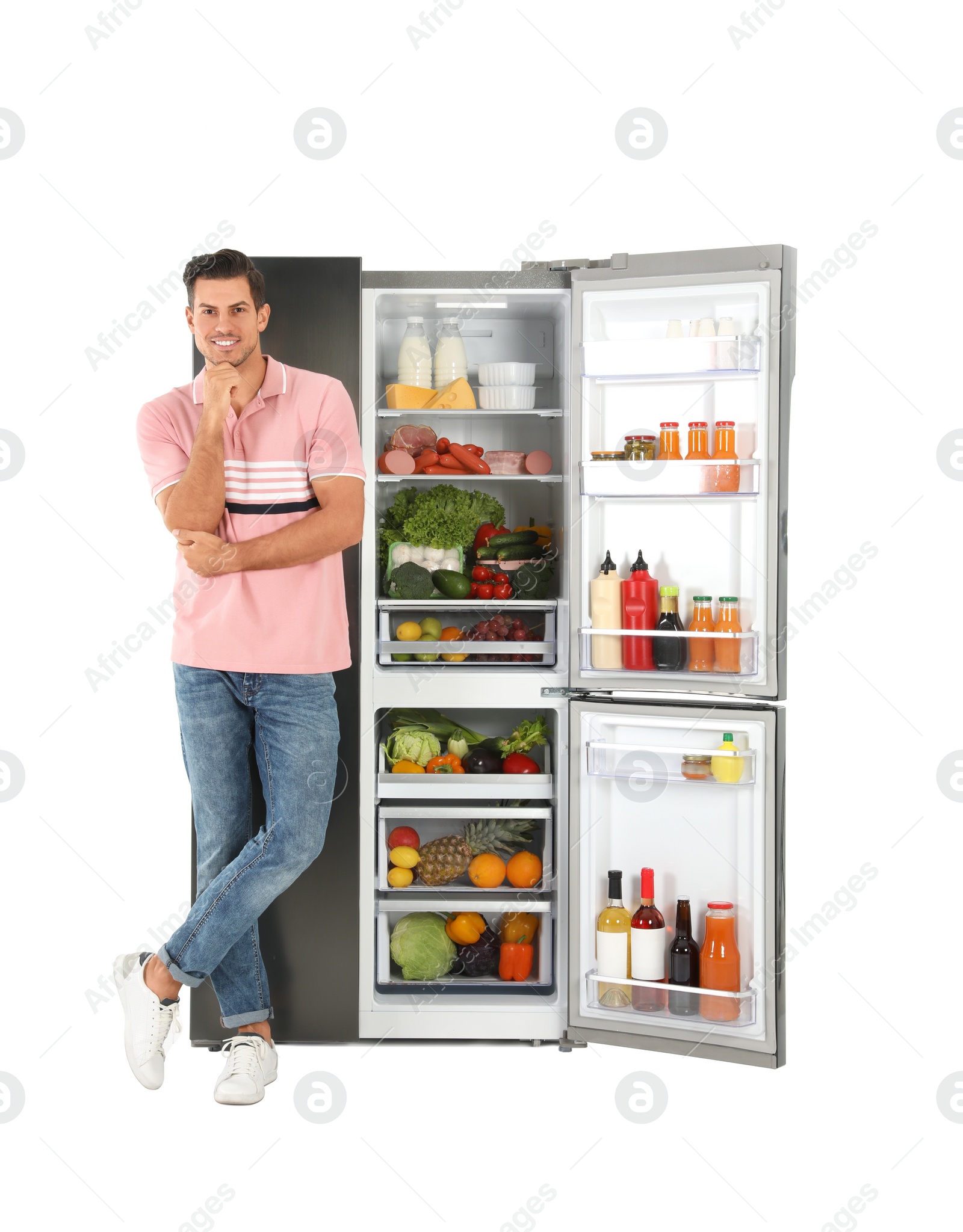 Photo of Man near open refrigerator on white background