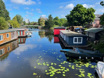 Beautiful view of canal with floating houses and boats