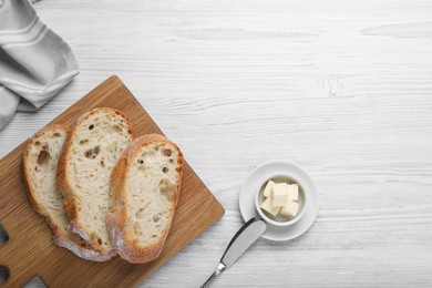 Photo of Flat lay composition with freshly baked sodawater bread on white wooden table. Space for text