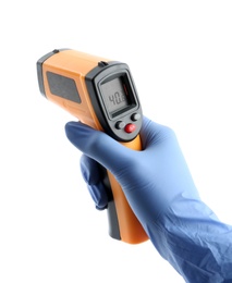 Photo of Doctor with infrared thermometer on white background, closeup. Checking temperature during Covid-19 pandemic