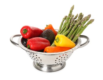 Photo of Metal colander with fresh peppers, asparagus and avocado isolated on white