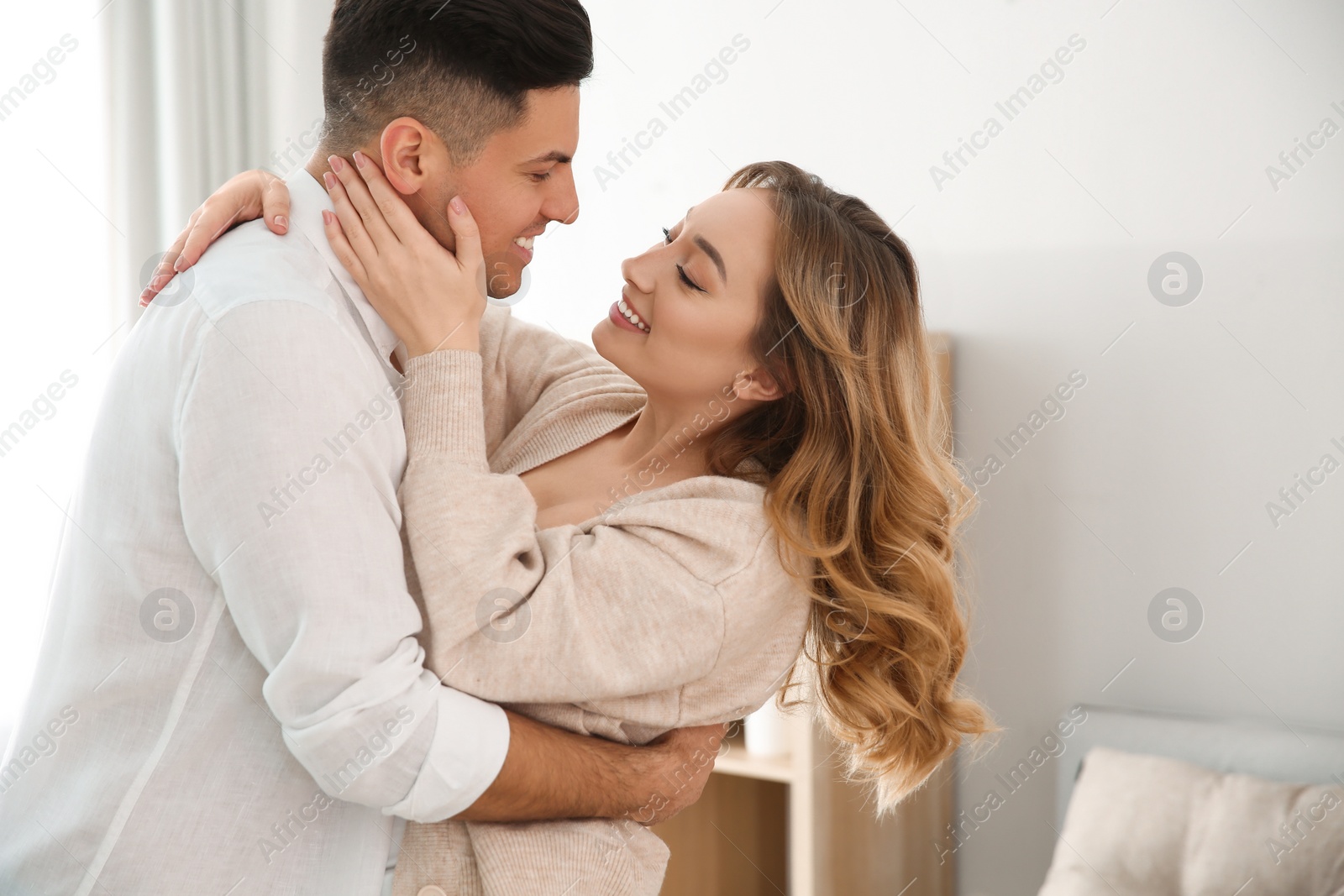 Photo of Lovely couple enjoying time together at home