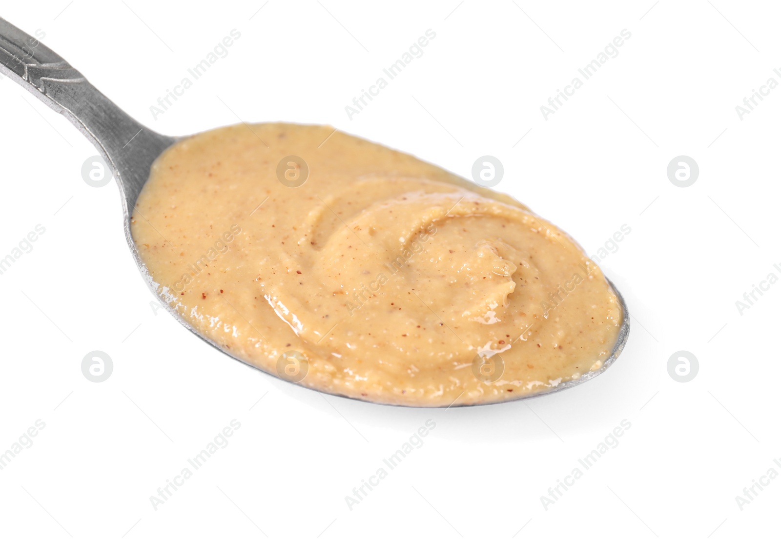 Photo of Delicious nut butter in spoon isolated on white