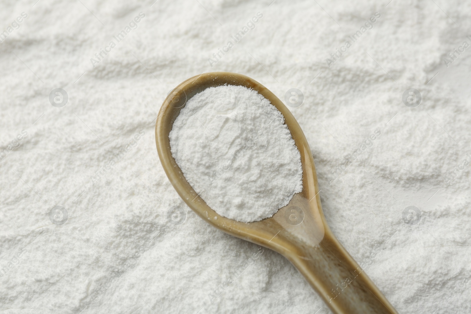 Photo of One spoon on baking powder, closeup view