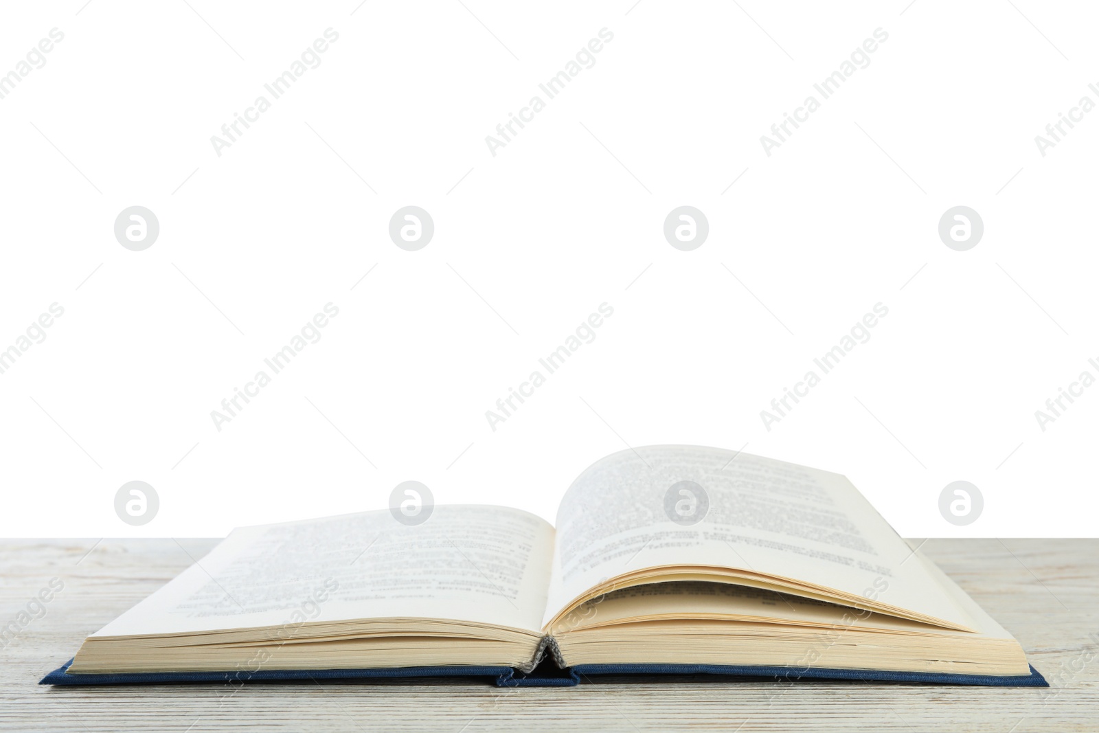 Photo of Open old hardcover book on wooden table