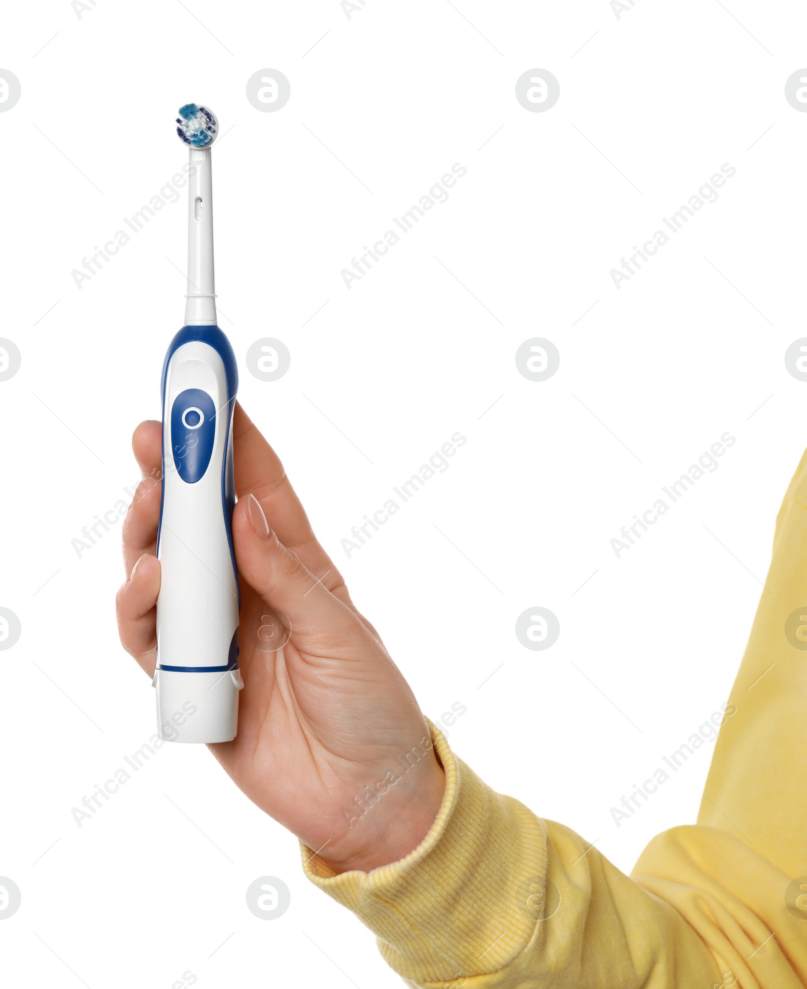 Photo of Woman holding electric toothbrush on white background, closeup