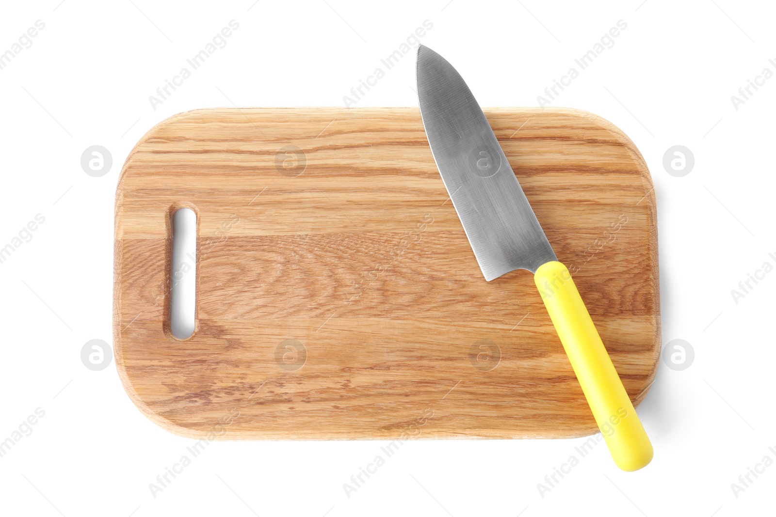 Photo of Wooden cutting board with chef's knife isolated on white, top view