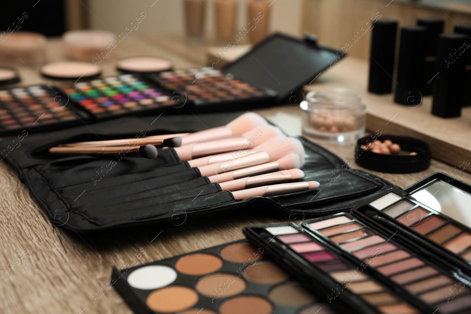 Photo of Professional makeup artists workplace with tools and cosmetic, closeup