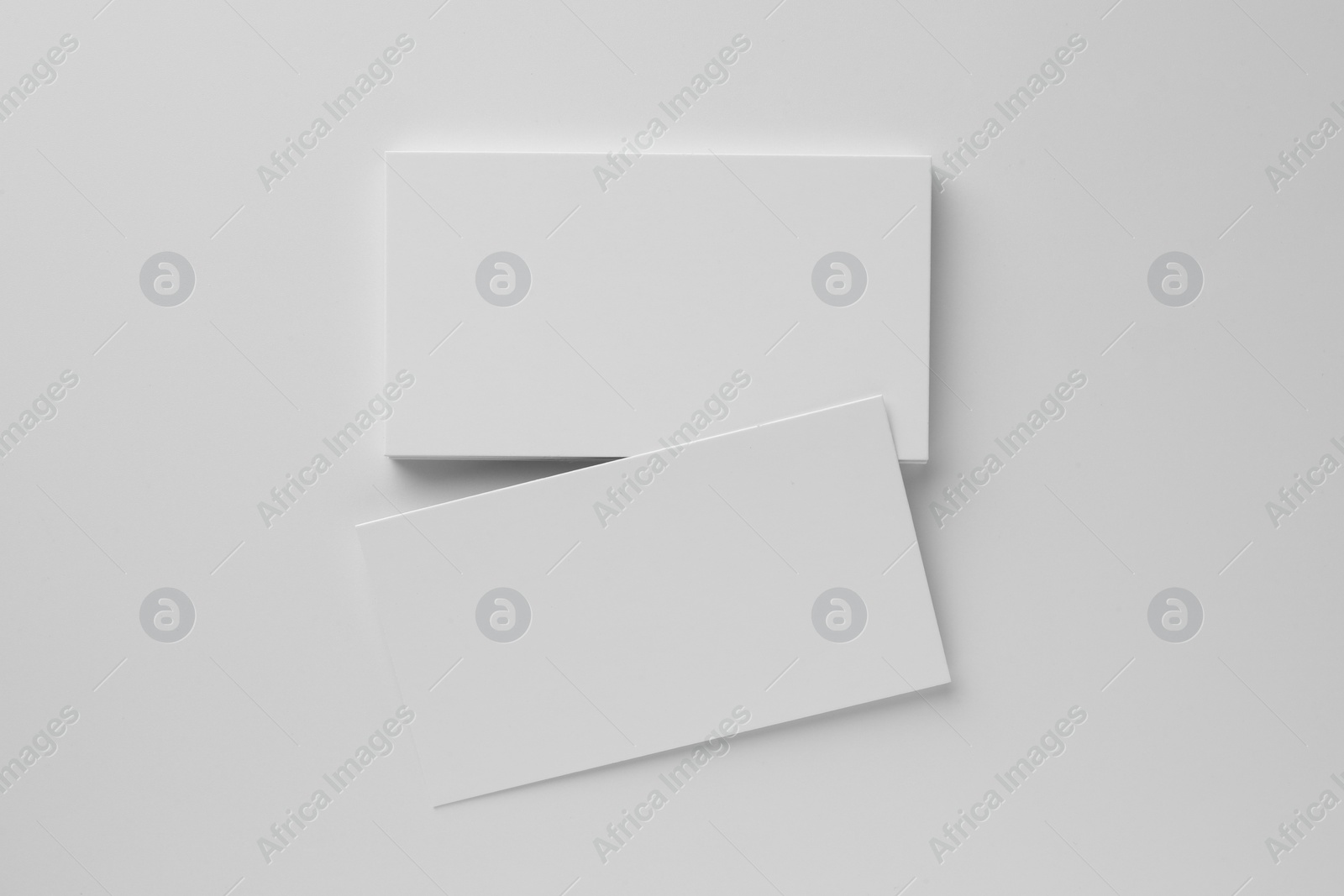 Photo of Blank business cards on white background, top view. Mockup for design